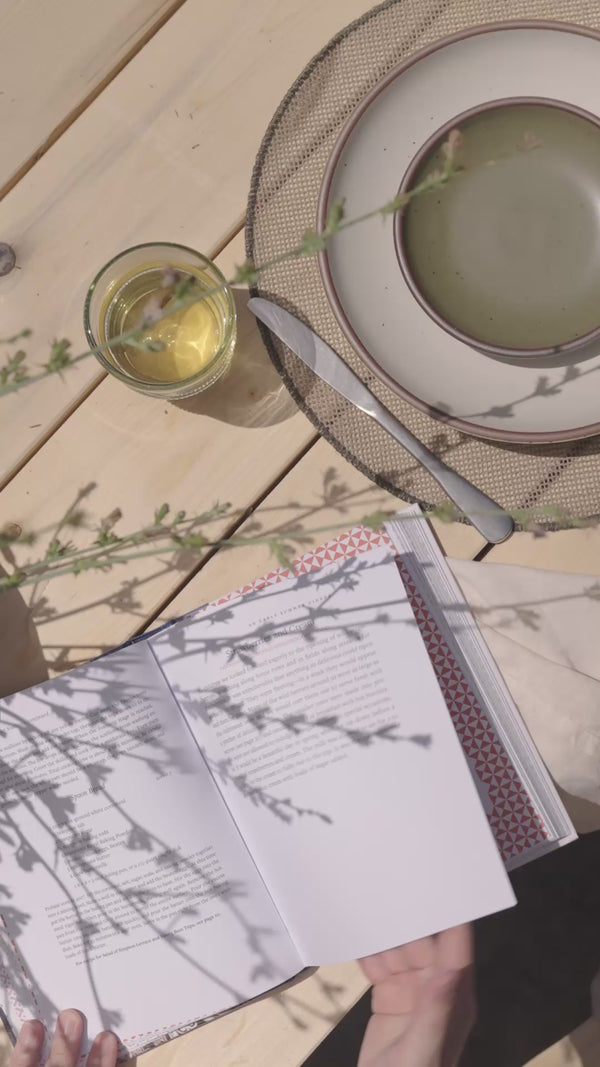Video of Connie reading Taste of Country Cooking and then in her kitchen cooking and baking and setting a table filled with food.